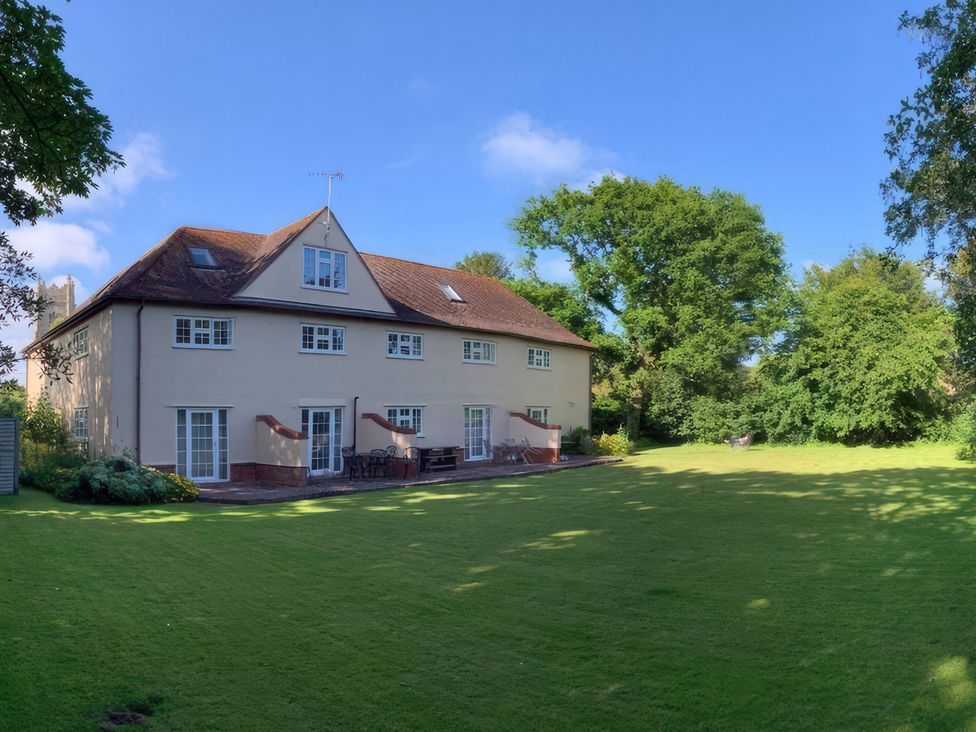A large house with a garden and patio at No 1 The Martins in Walberswick