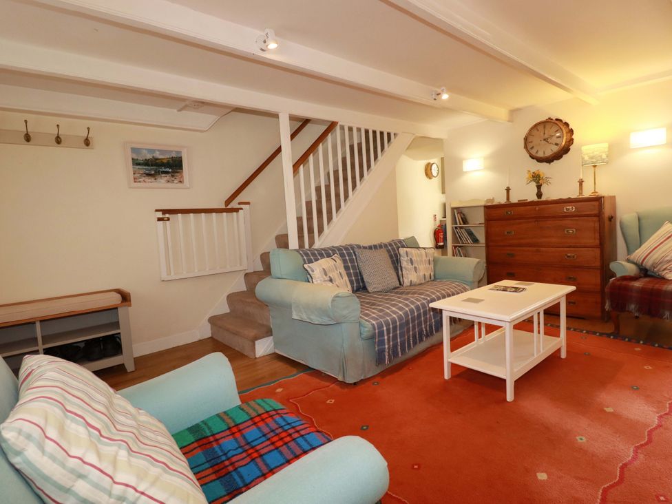 A living room with a sofa and coffee table at Mary’s House