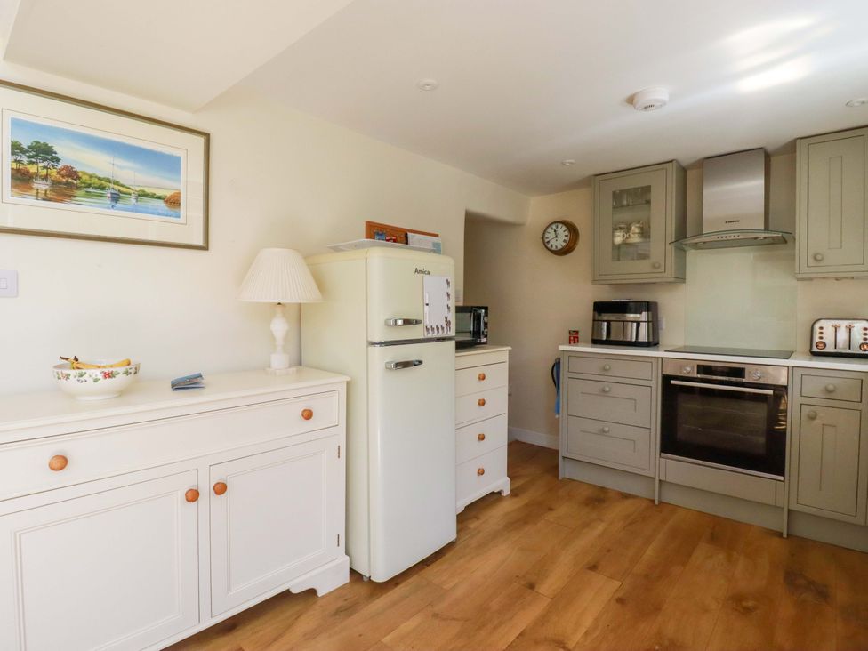 A kitchen with appliances and storage at Mary’s House