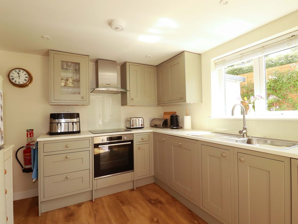 A kitchen with cabinets and appliances at Mary’s House