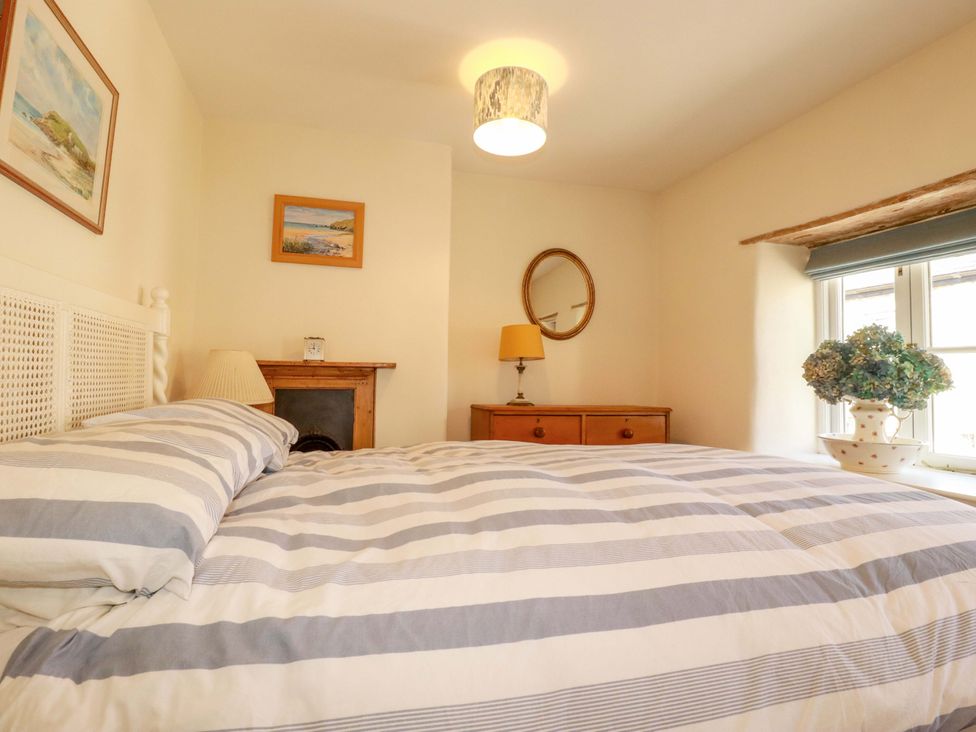 A bedroom with a bed and chest of drawers at Mary’s House