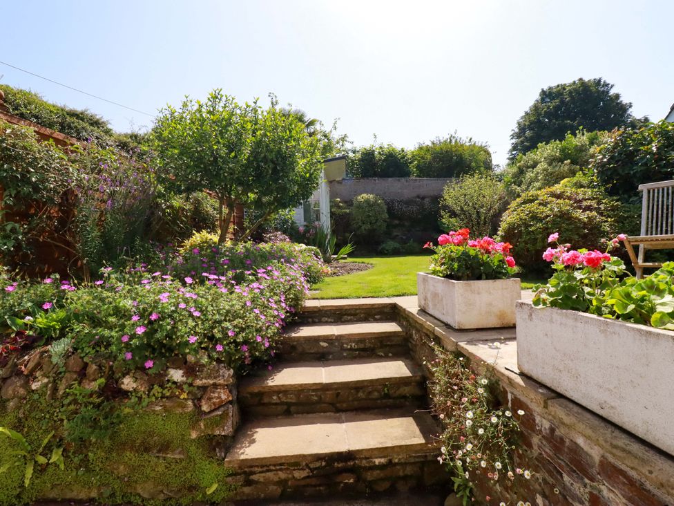 A garden with flowers and steps at Mary’s House