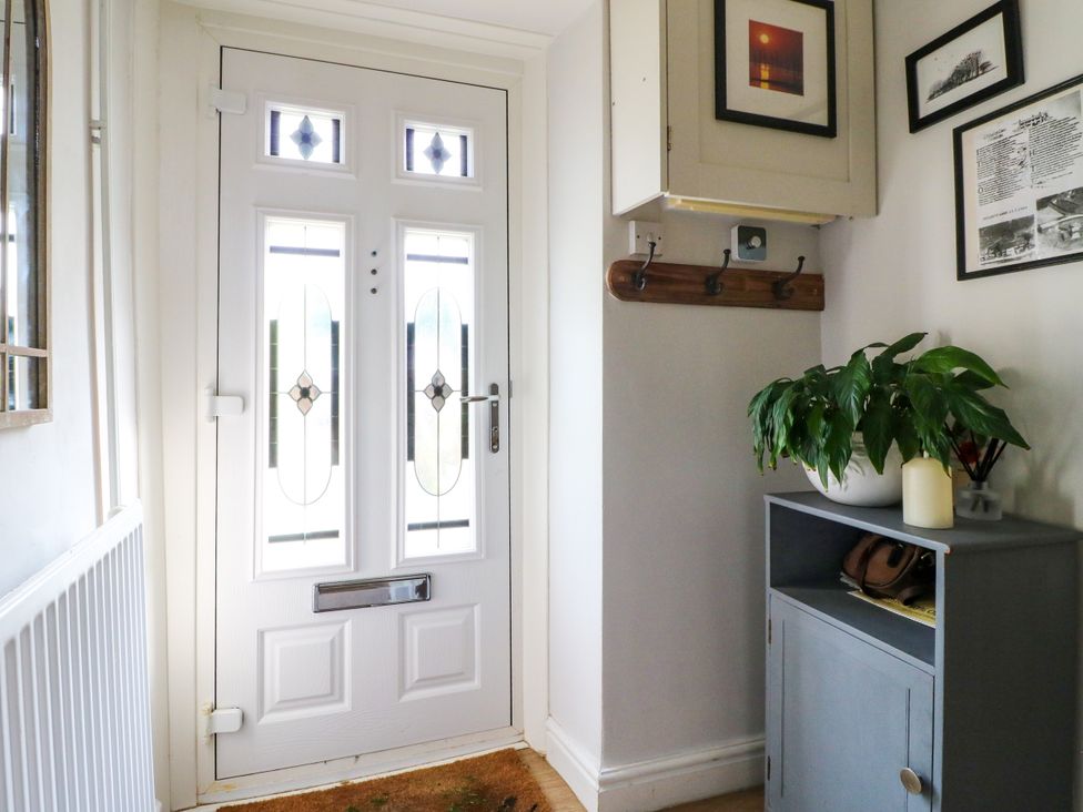 An entrance hall with a front door and coat hooks at Sunnyside Elton