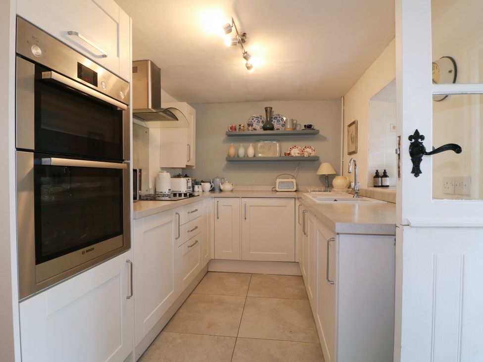 A kitchen with cabinets and appliances at Sunnyside in Elton