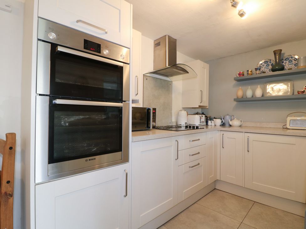 A kitchen with an oven and microwave at Sunnyside in Elton