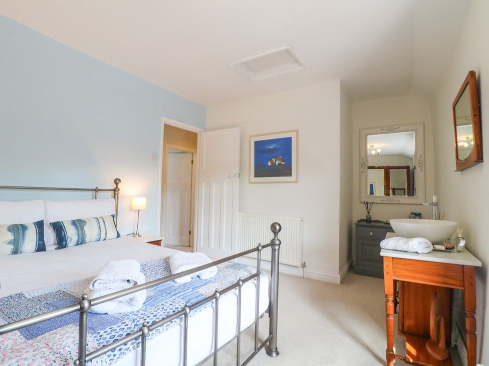 A bedroom with a bed and sink at Sunnyside in Elton
