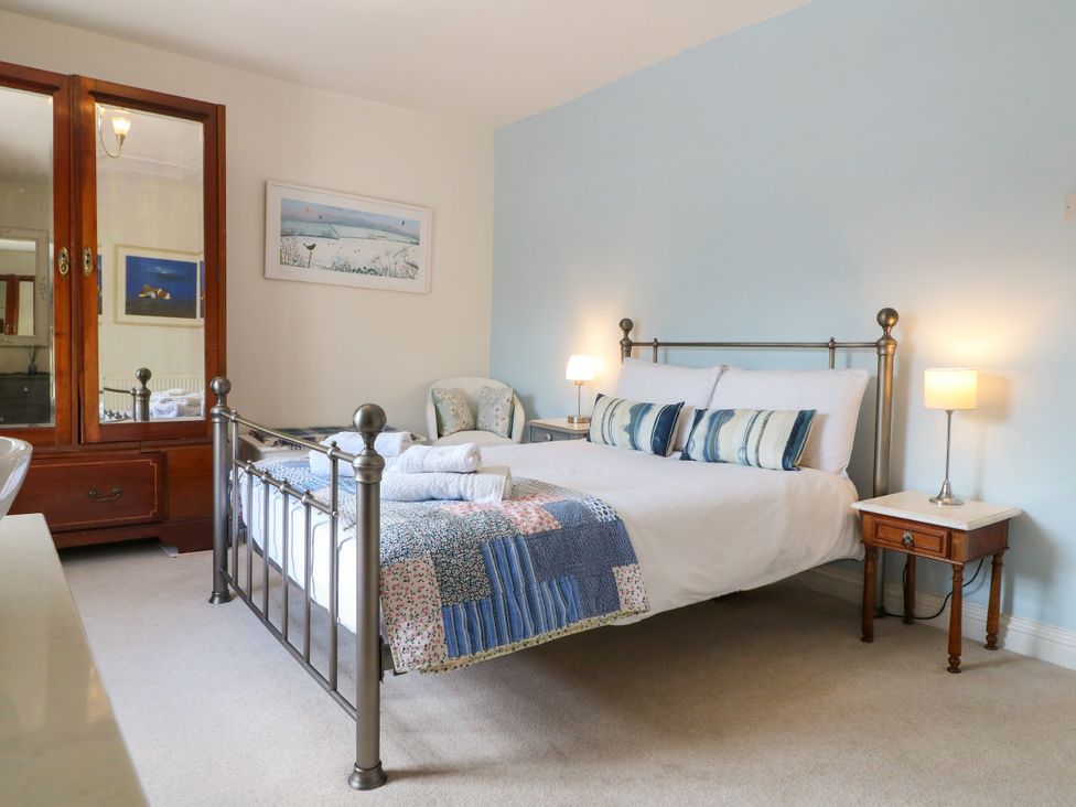 A bedroom with a bed and bedside table at Sunnyside in Elton