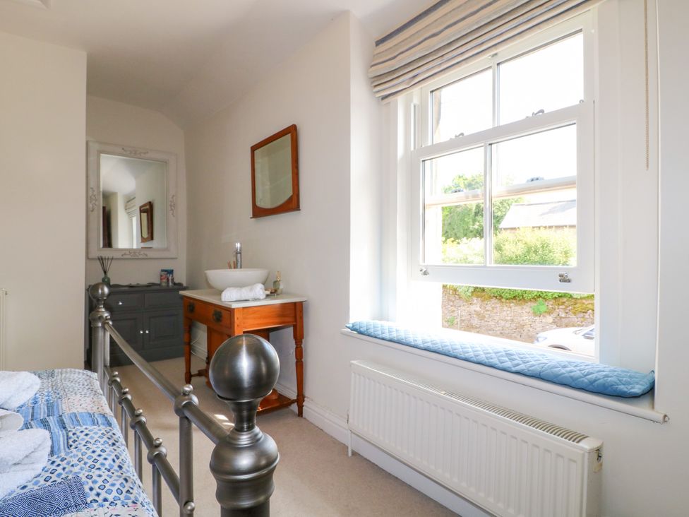 A bedroom featuring a bed and a vanity at Sunnyside in Elton