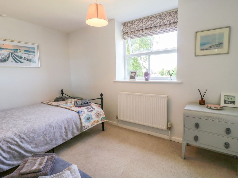 A bedroom with a bed and a window at Sunnyside in Elton
