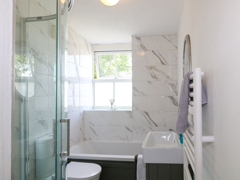 A bathroom with a bathtub, shower, and toilet at Sunnyside in Elton