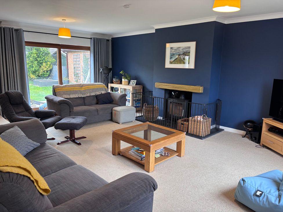 A living room with a coffee table and sofa at 7 Adrian Close Porthcawl