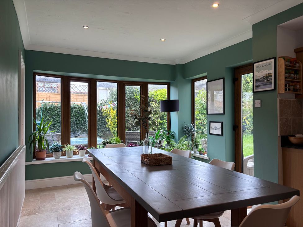 A dining room with a table and chairs at 7 Adrian Close Porthcawl