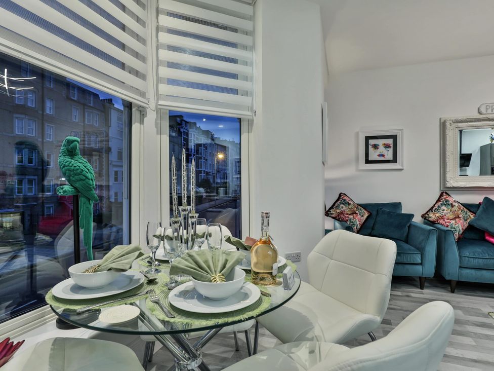 A dining room with a glass table and chairs at 1 Bed Flat - Sleeps 2 - Parking - Wifi in Scarborough