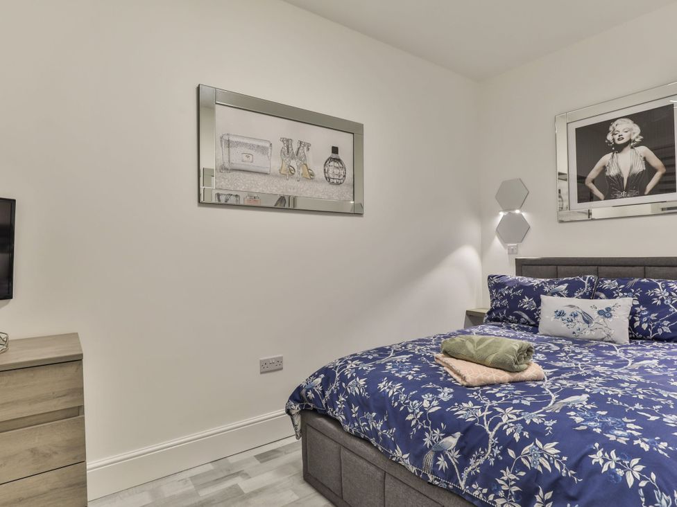 A bedroom with a bed and a television at 1 Bed Flat - Sleeps 2 - Parking - Wifi in Scarborough