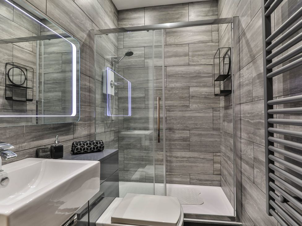 A bathroom with a sink, toilet, and shower at 1 Bed Flat - Sleeps 2 - Parking - Wifi in Scarborough