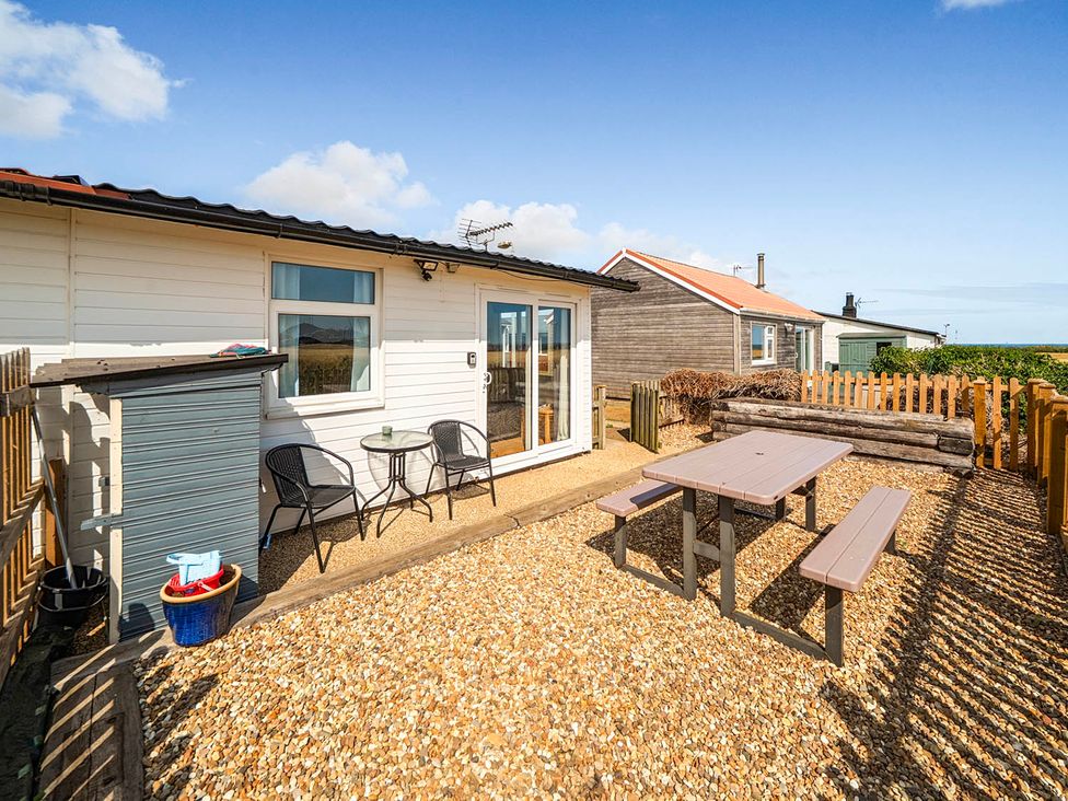 An outdoor area with seating and table at Bay View Chalet 2 Bed Sleeps 4 Pets Garden Beach, Wilsthorpe near Bridlington