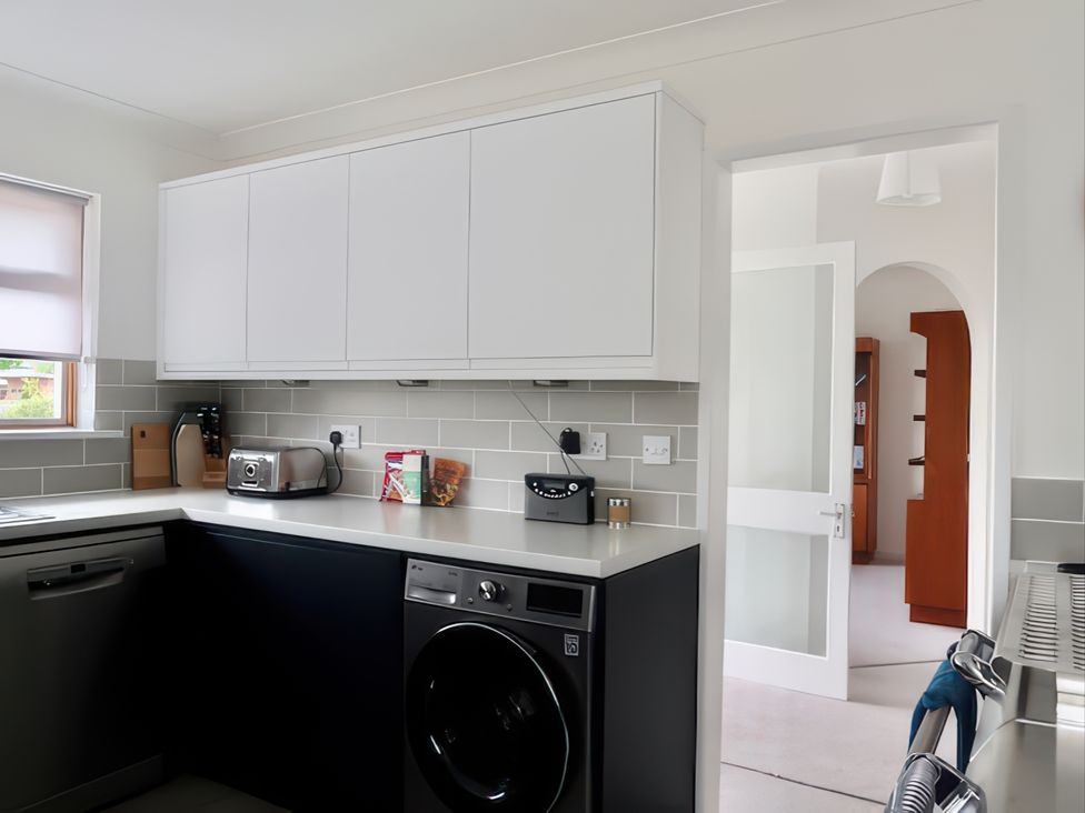 A kitchen with appliances and cabinetry at Sleeps 9 KingBeds Family Friendly Pityme near Penmayne