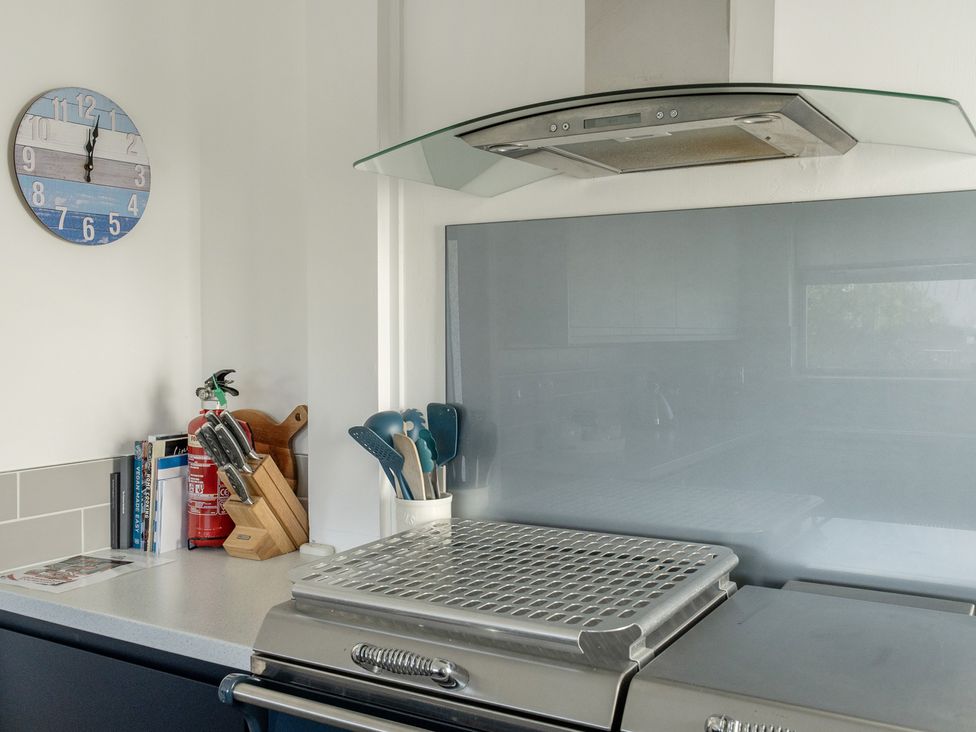 A kitchen with an extractor hood and utensils at Sleeps 9 KingBeds Family Friendly in Pityme near Penmayne