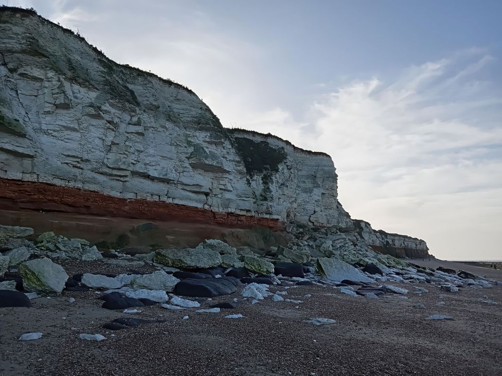 A beach with cliffs and rocks at Super 2 bed 6 berth caravan pets go free in Hunstanton