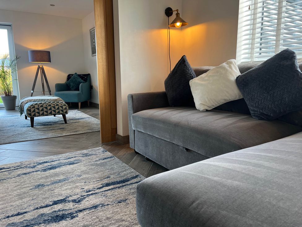A living room with a sofa and table at 