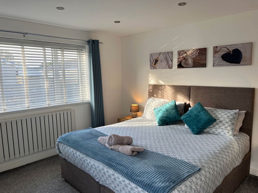 A bedroom with a bed and window at 