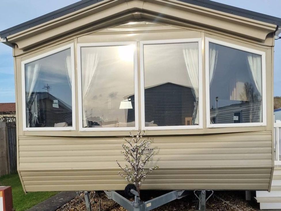 A trailer with large windows at a location