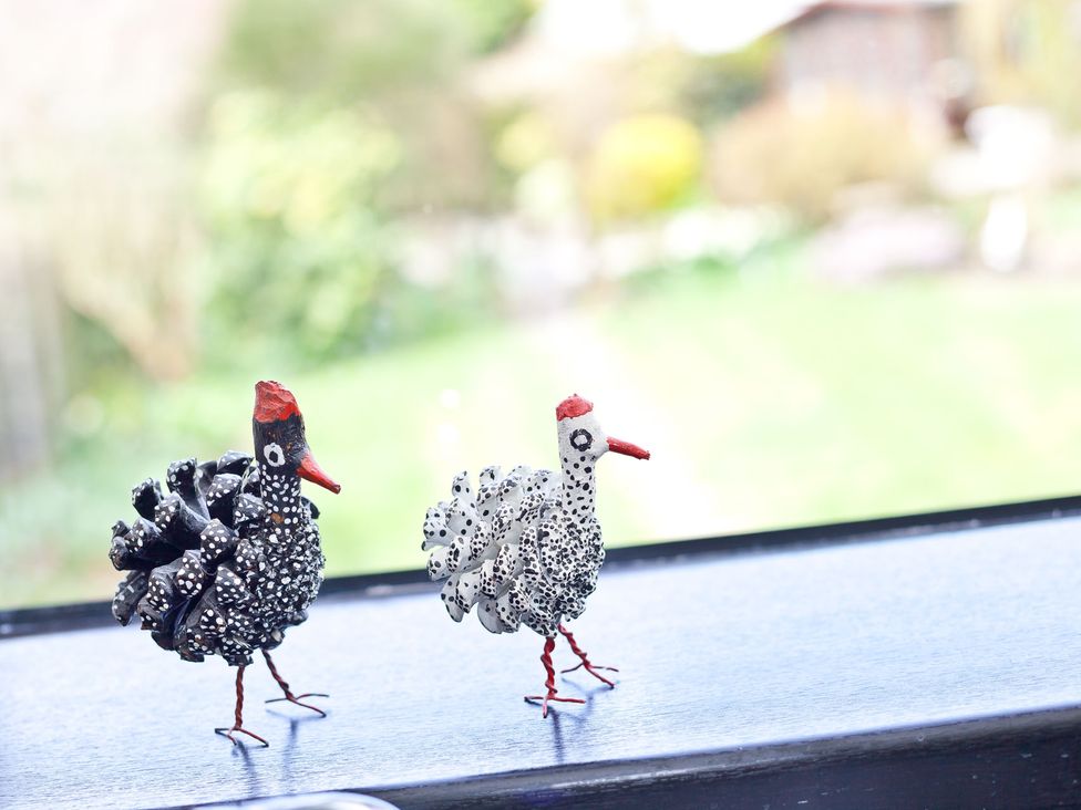 Decorative bird figures on a surface at Lothlorien in Grange over Sands
