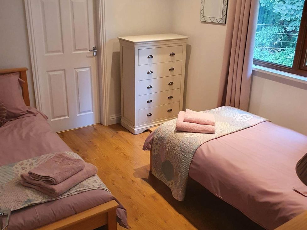 A bedroom with beds and a dresser at Stunning 2 Bedroom Pet Friendly Lodge in Bridlington