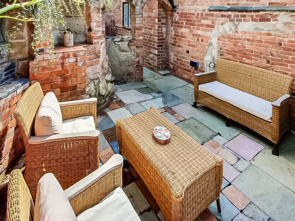 An outdoor seating area with wicker furniture at a property