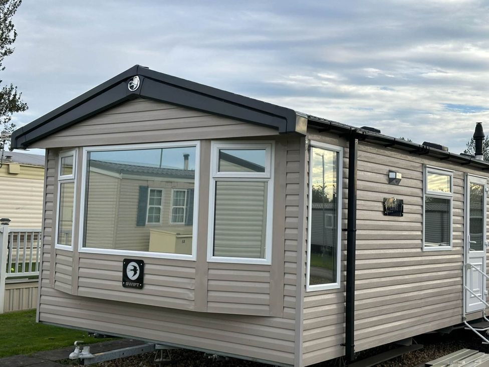 A caravan exterior view at R&R Coastal Retreats Cedars 63 in Skegness