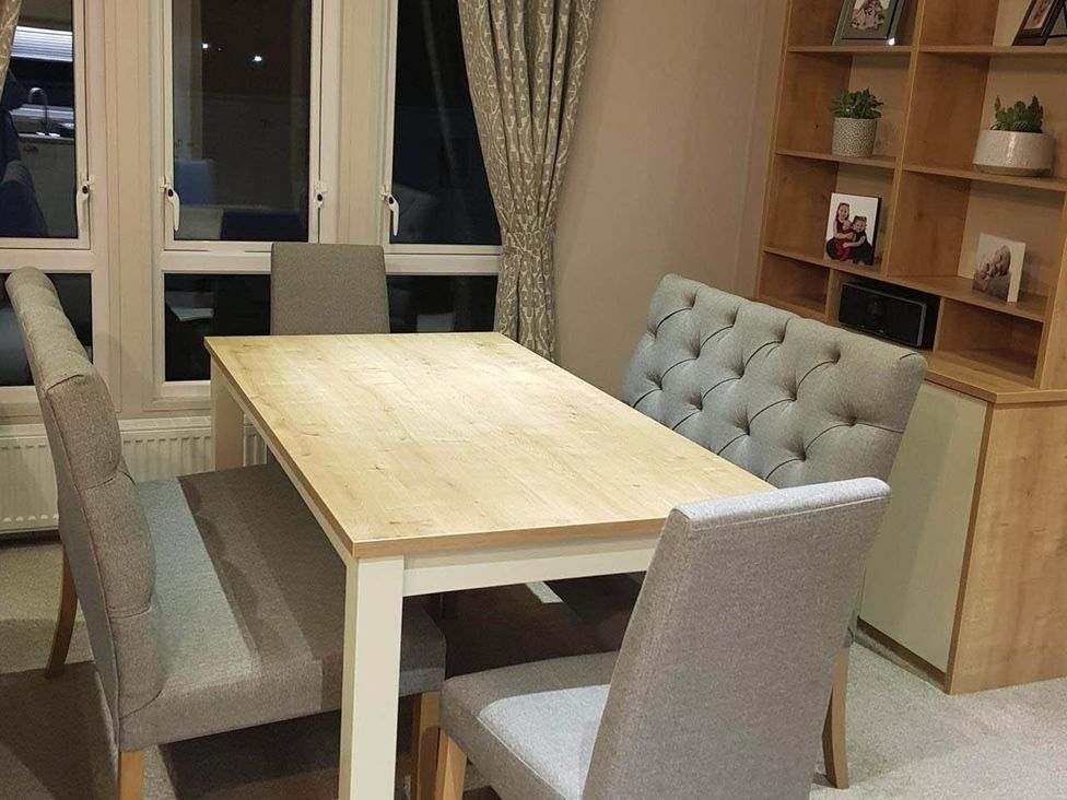 A dining area with a table and chairs at Cayton Bay Lodge Parkdean Resorts in Scarborough