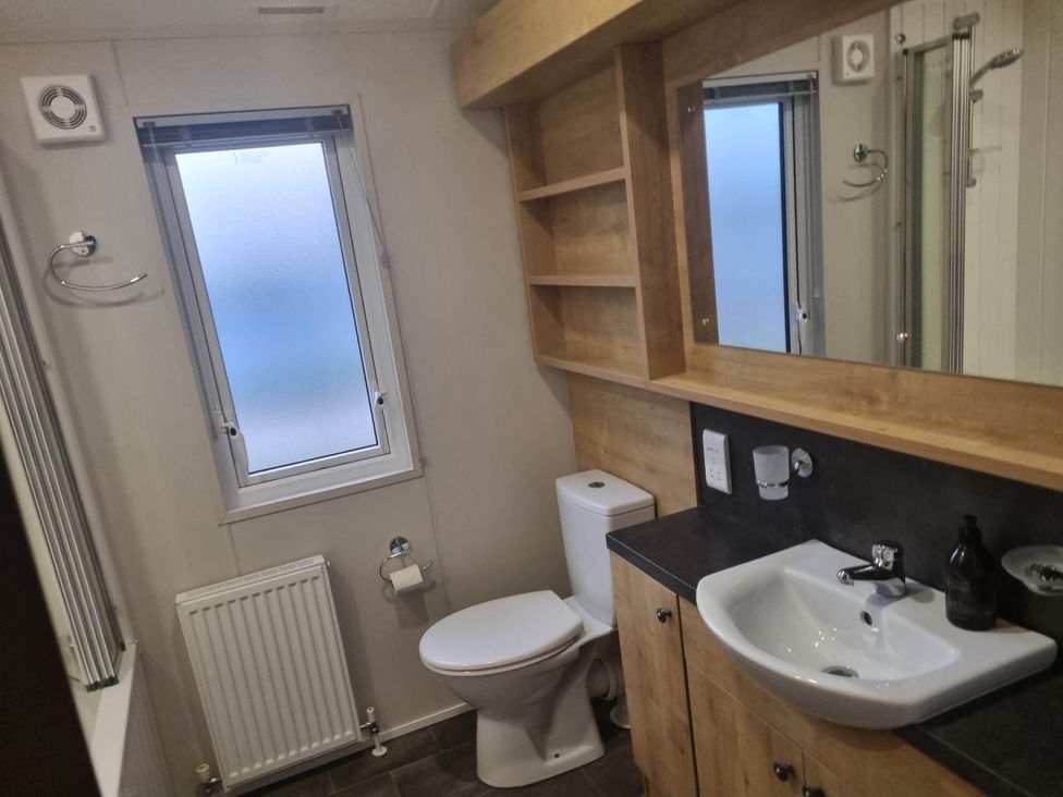 A bathroom with sink and toilet at Cayton Bay Lodge Parkdean Resorts Scarborough