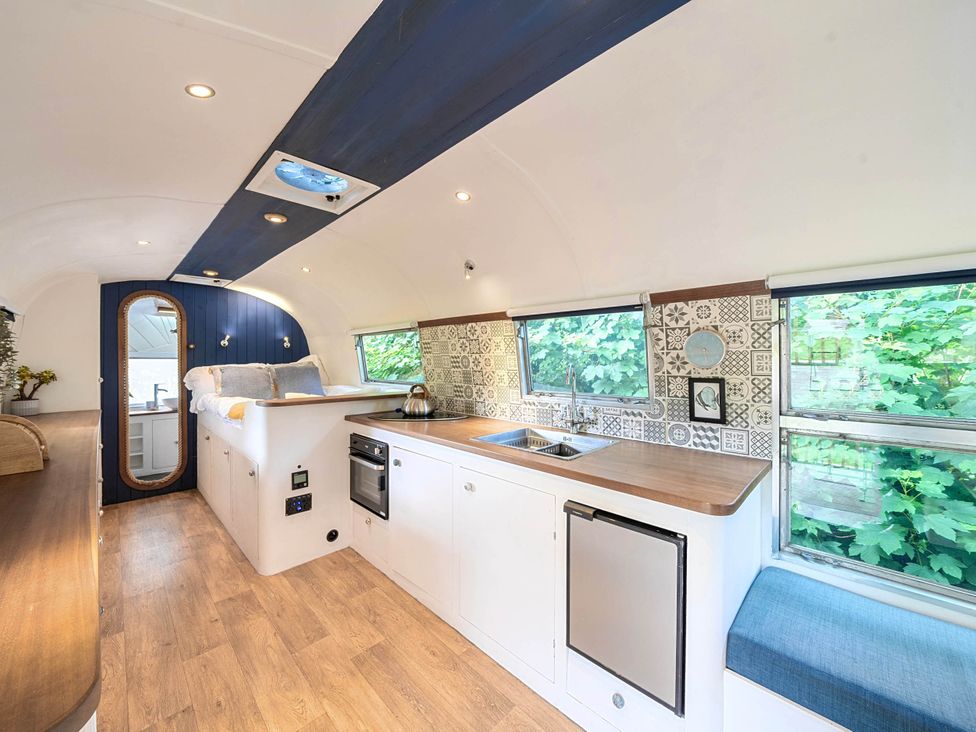A kitchen with sink and stove at Sleeps 2 - Private Hot Tub - Fire Pit in St. Dogmaels near Cardigan