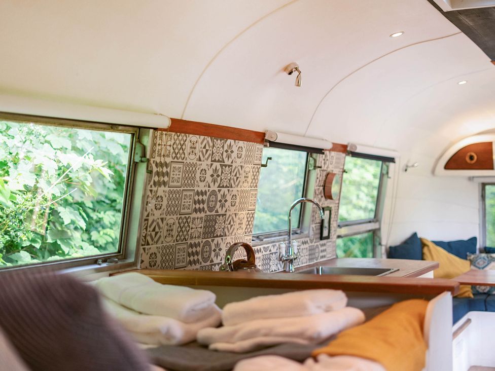 A kitchen with sink and towels in an Airstream at Sleeps 2 - Private Hot Tub - Fire Pit, St. Dogmaels near Cardigan