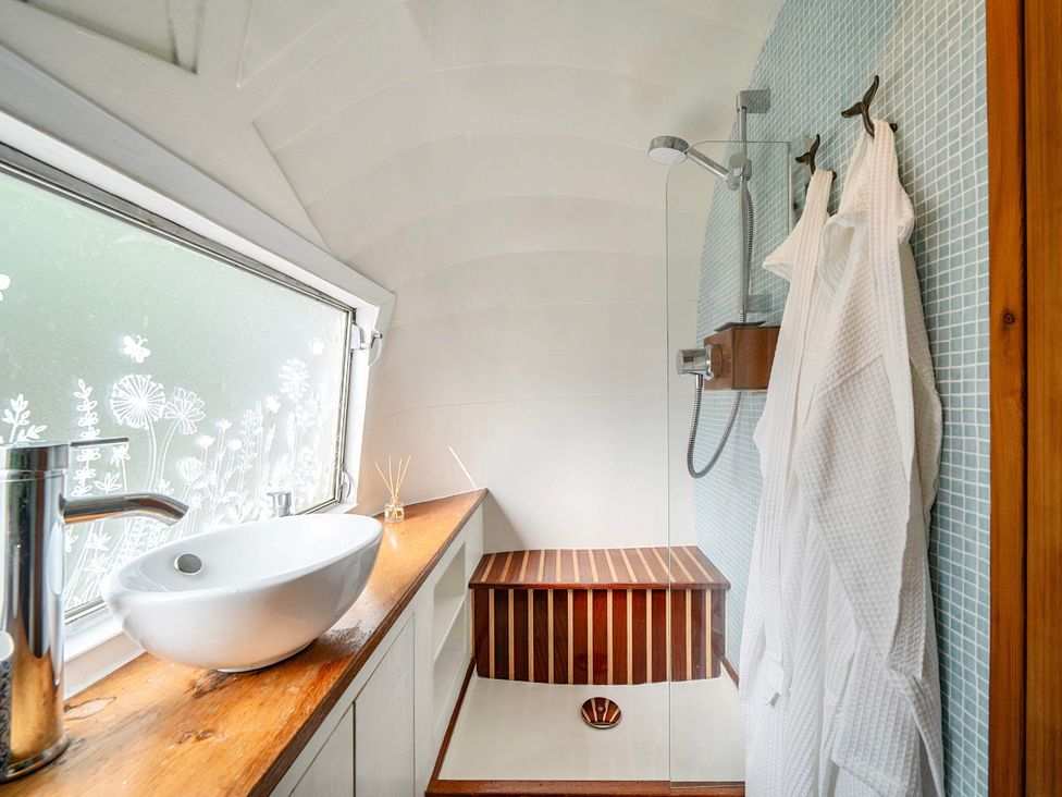 A bathroom with a sink and shower at Sleeps 2 - Private Hot Tub - Fire Pit, St. Dogmaels near Cardigan