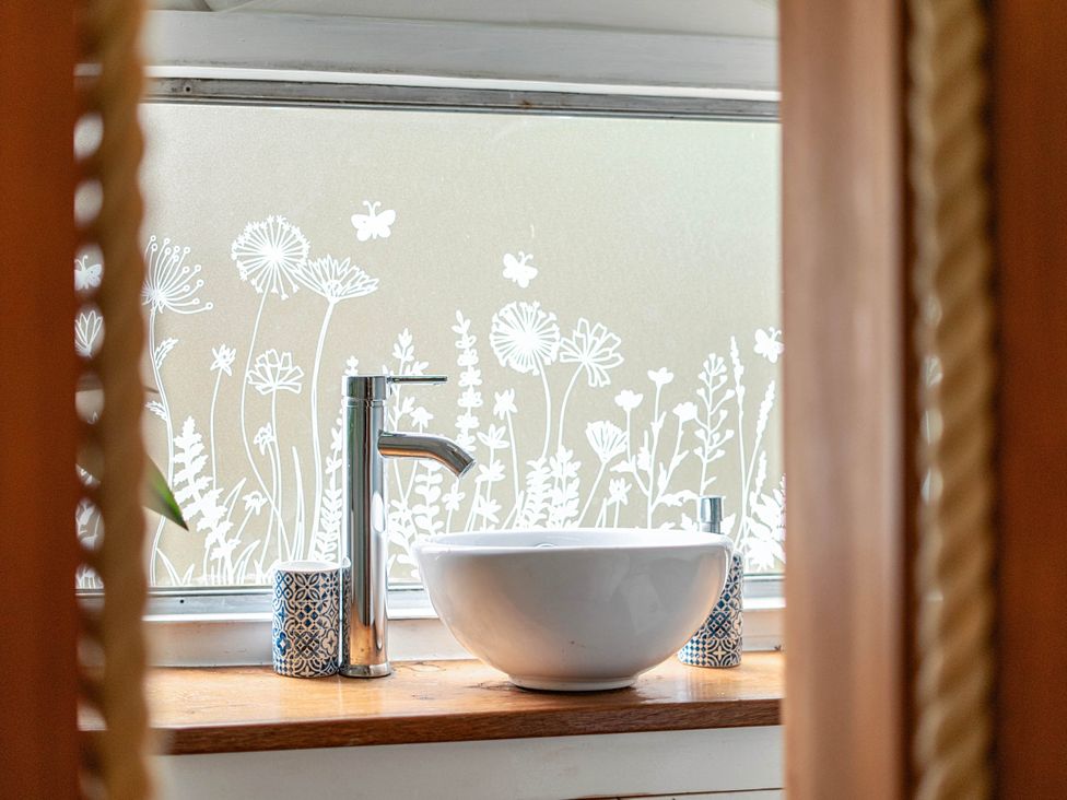 A bathroom sink with a bowl and tap at Sleeps 2 - Private Hot Tub - Fire Pit in St. Dogmaels near Cardigan