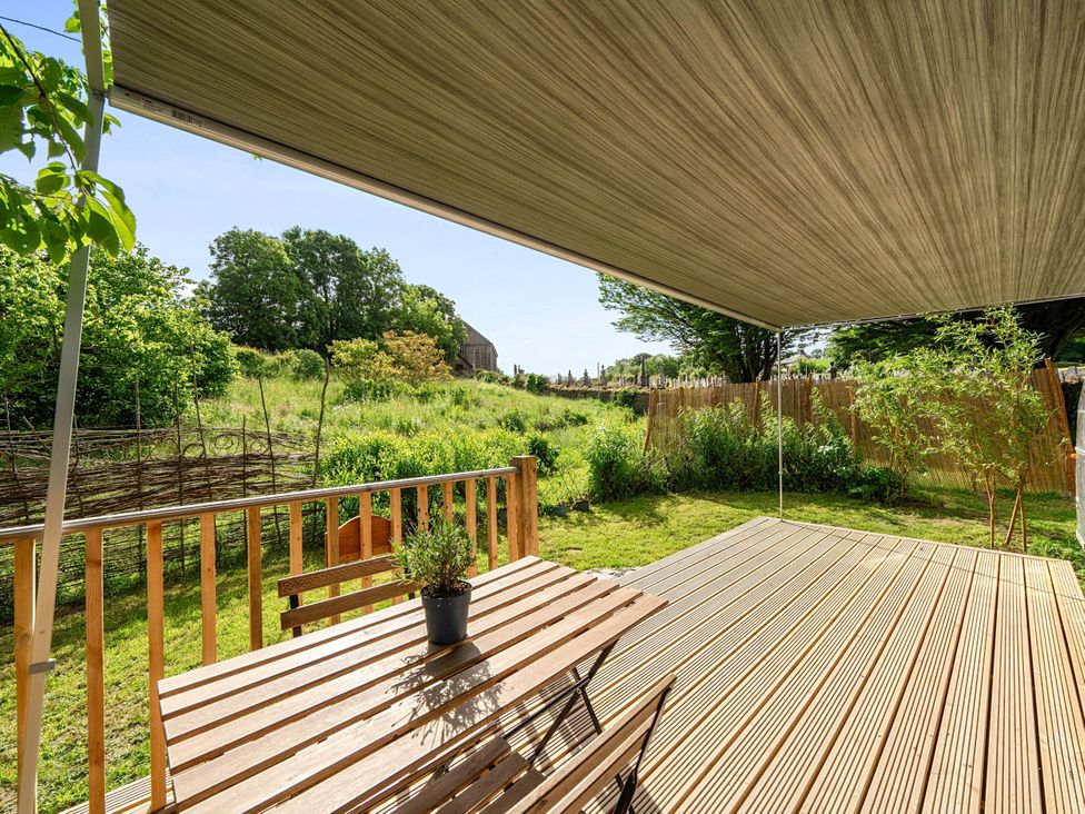 An outdoor space with a table and chairs in St. Dogmaels near Cardigan
