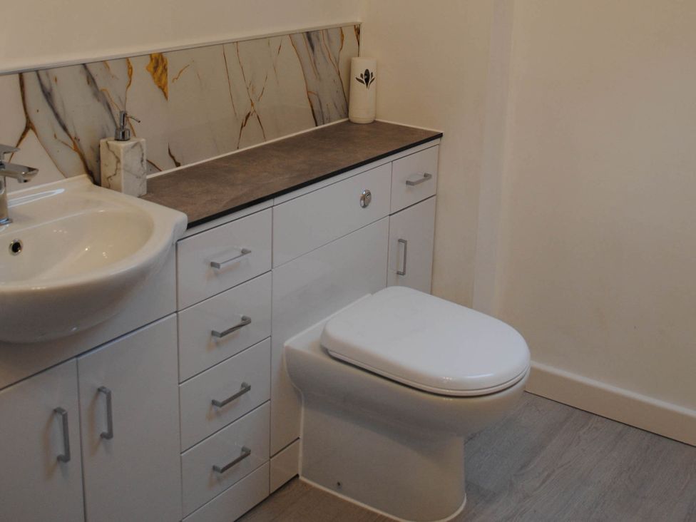 A bathroom with a sink and toilet at The Old Barn in Manchester
