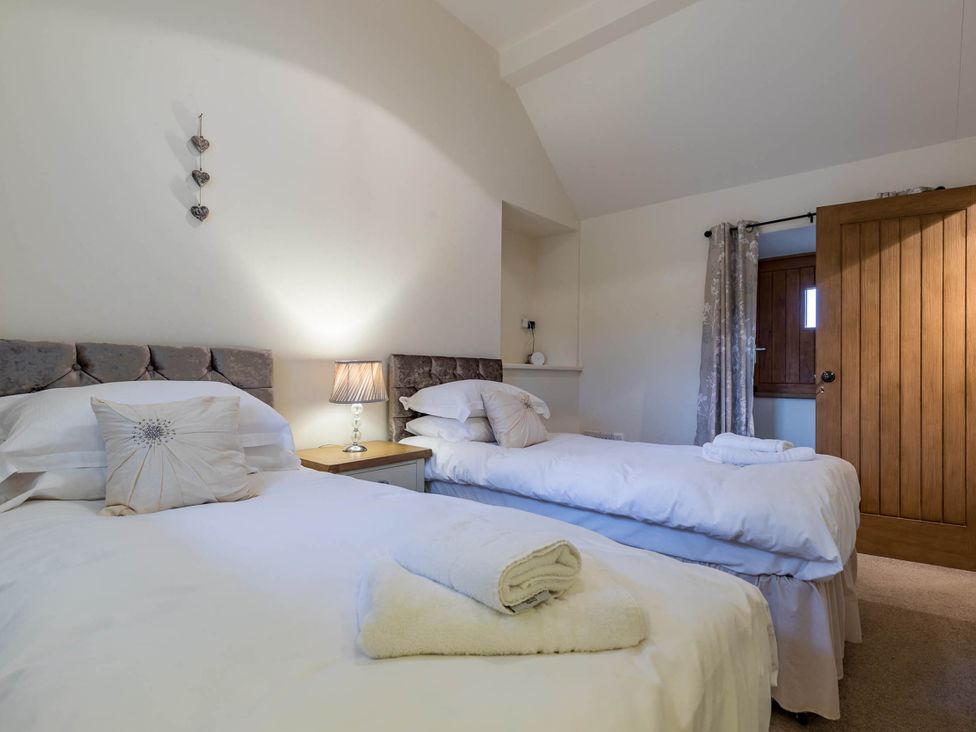 A bedroom with two beds and a door at the property