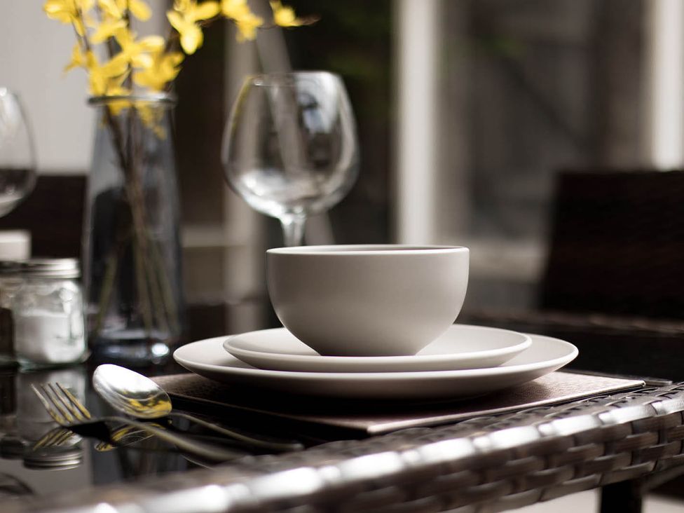 A table setting with a bowl and plate at Cottage Sleeps4  PetFriendly  Garden  ByBeach in Lytham St Annes