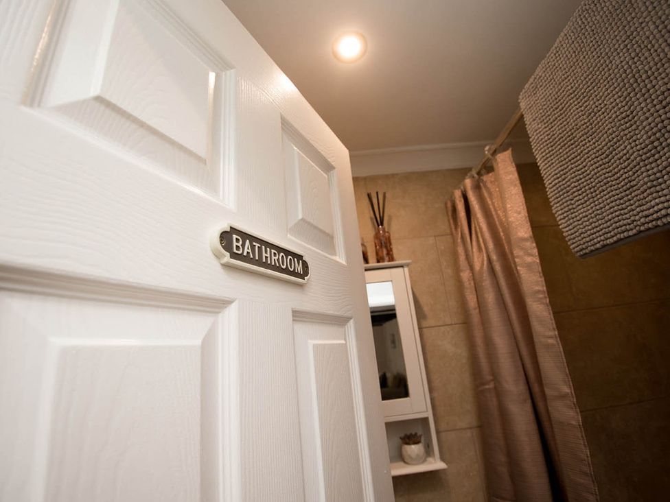 A bathroom door with a sign at Cottage Sleeps4 PetFriendly Garden ByBeach in Lytham St Annes