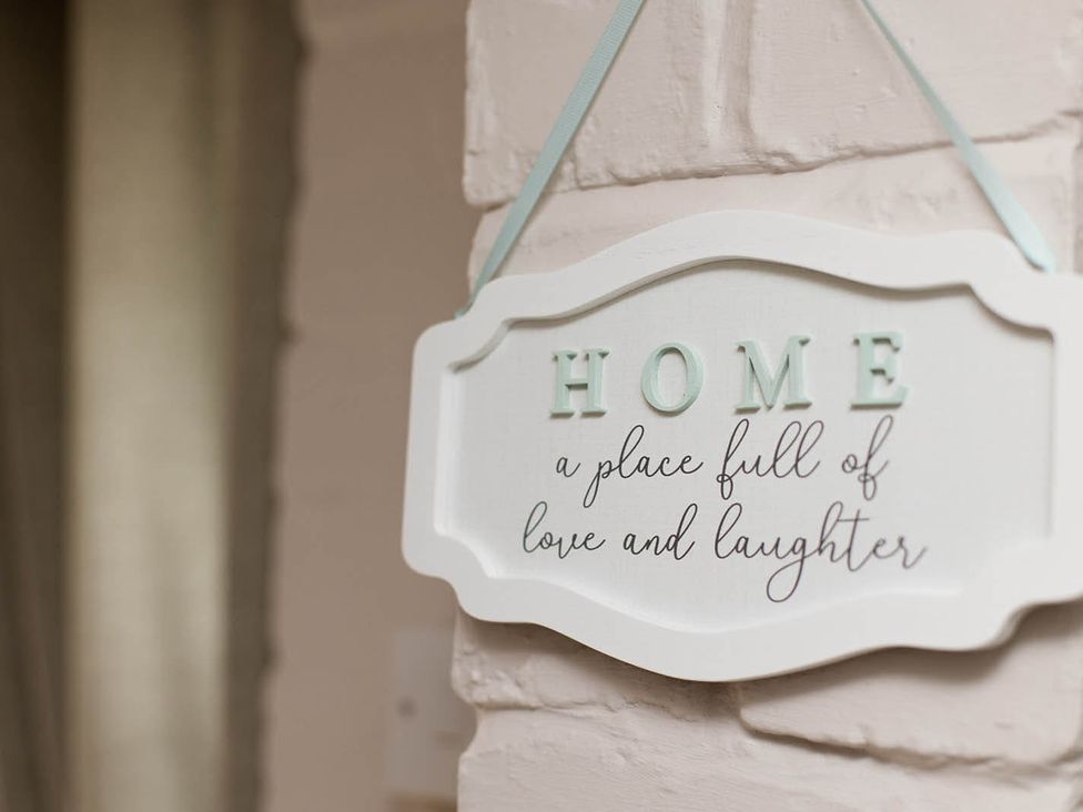 A sign that reads HOME a place full of love and laughter