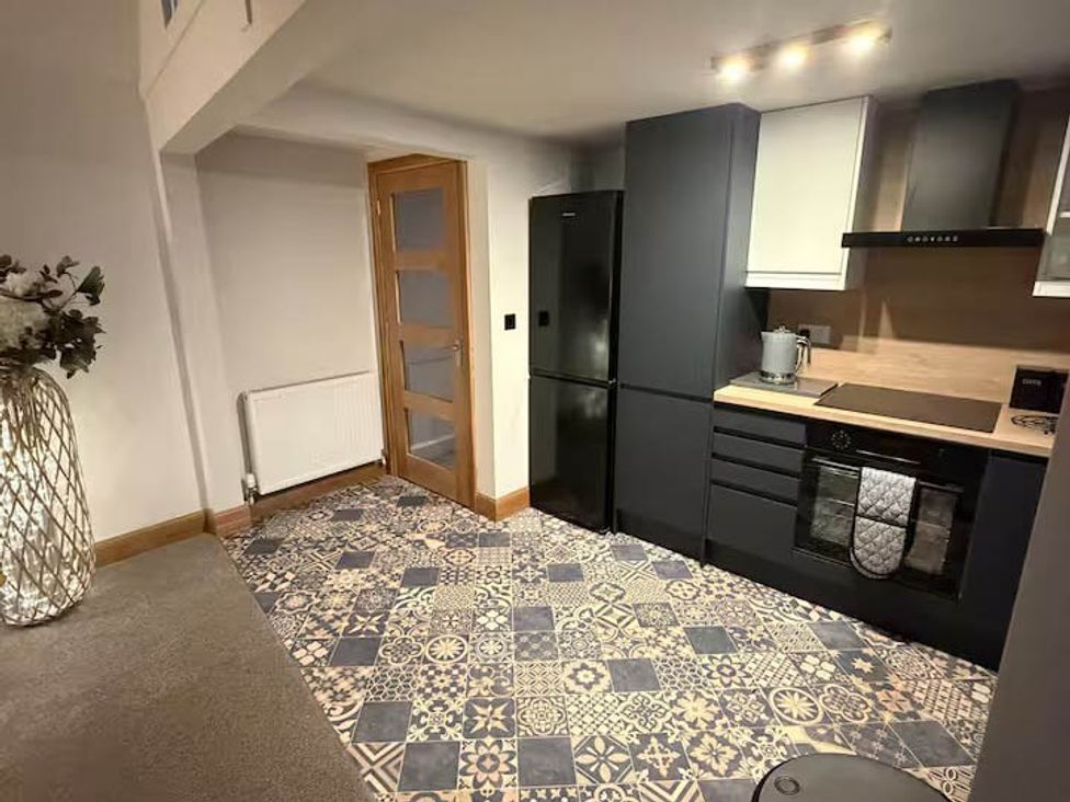 A kitchen with a refrigerator and an oven at 2 Bed Cottage Sleeps 4 Parking Wifi Darnick