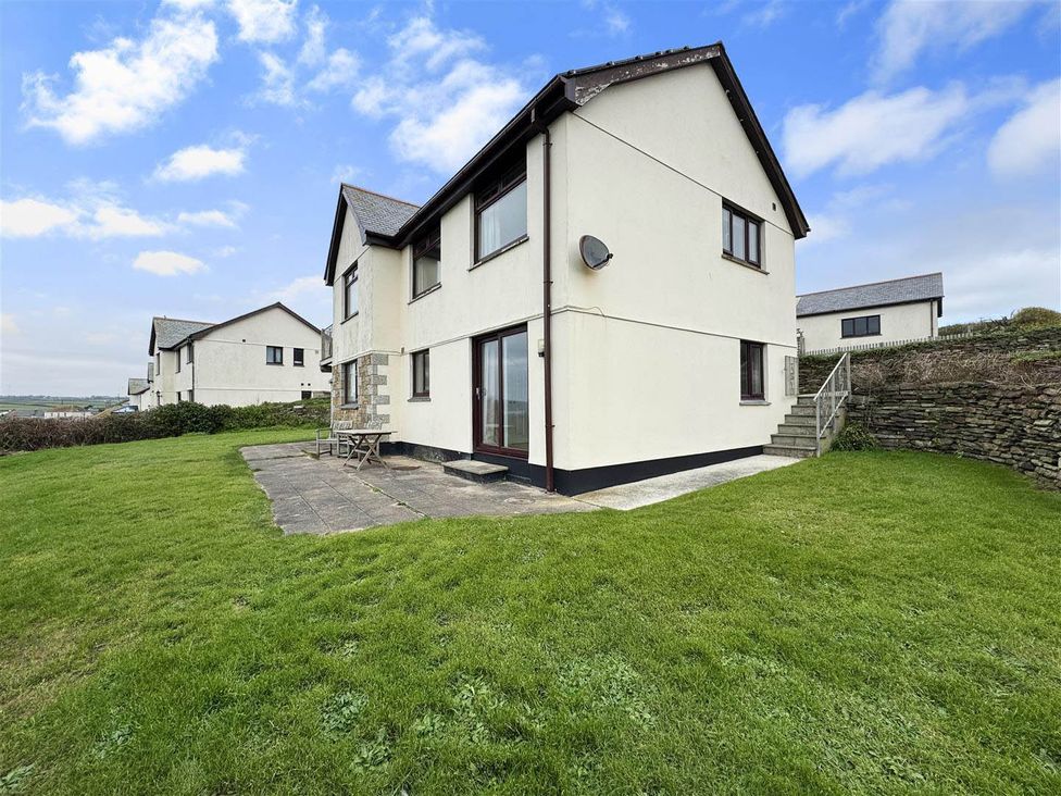 A house with patio and lawn at Porthleven Coastal Retreat with 5 Bedrooms in Porthleven