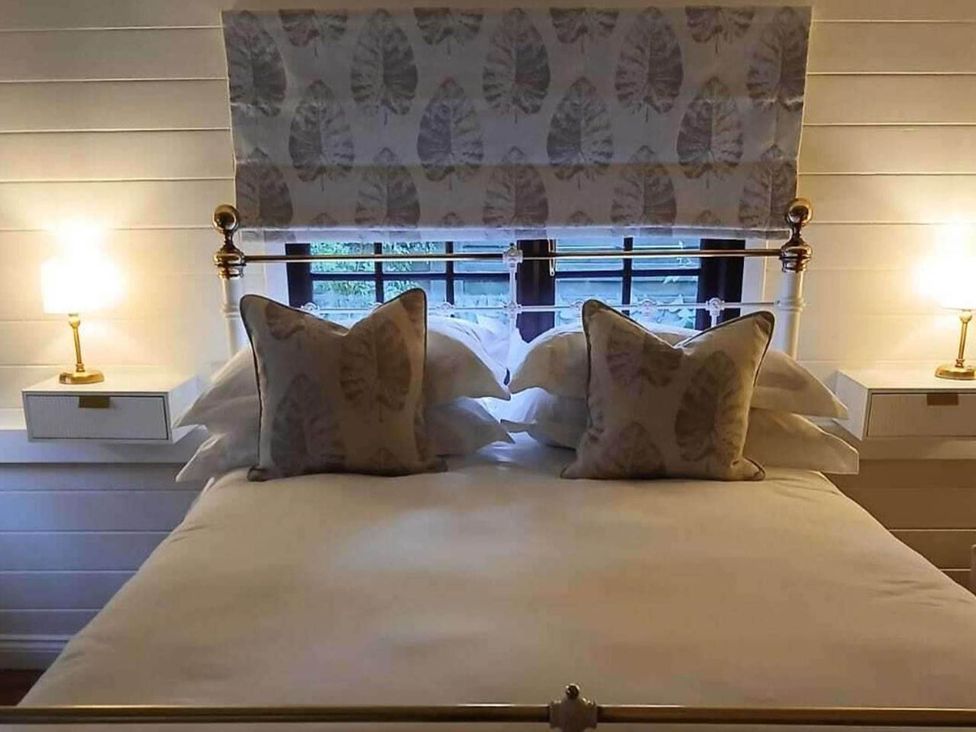 A bedroom with a bed and pillows at 1 Bed Lodge Southampton Sleeps 2 Parking in Southampton
