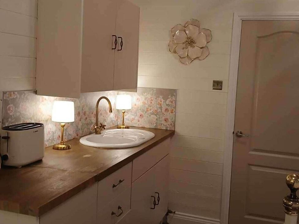 A kitchen with a sink and a toaster at 1 Bed Lodge Southampton Sleeps 2 Parking in Southampton