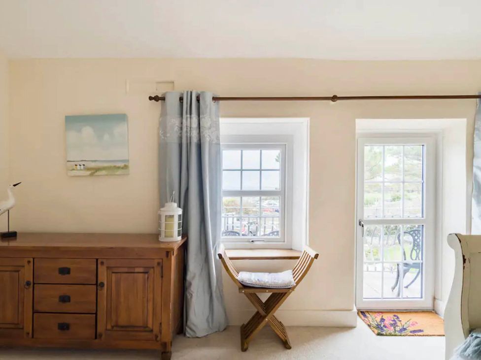 A room with a chest of drawers and a window at Beautiful Sea Front Cottage in Plymouth