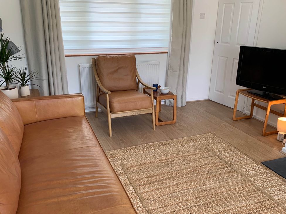 A living room with a sofa and armchair at 2 Bed Sleeps 4 Parking Pets 10 min walk to Beach Falmouth