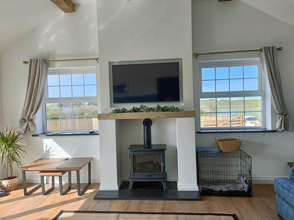 A living room with a tv above a fireplace at Aberporth 2 Bed Cottage Sleeps 4 Pet Friendly, Parcllyn near Aberporth