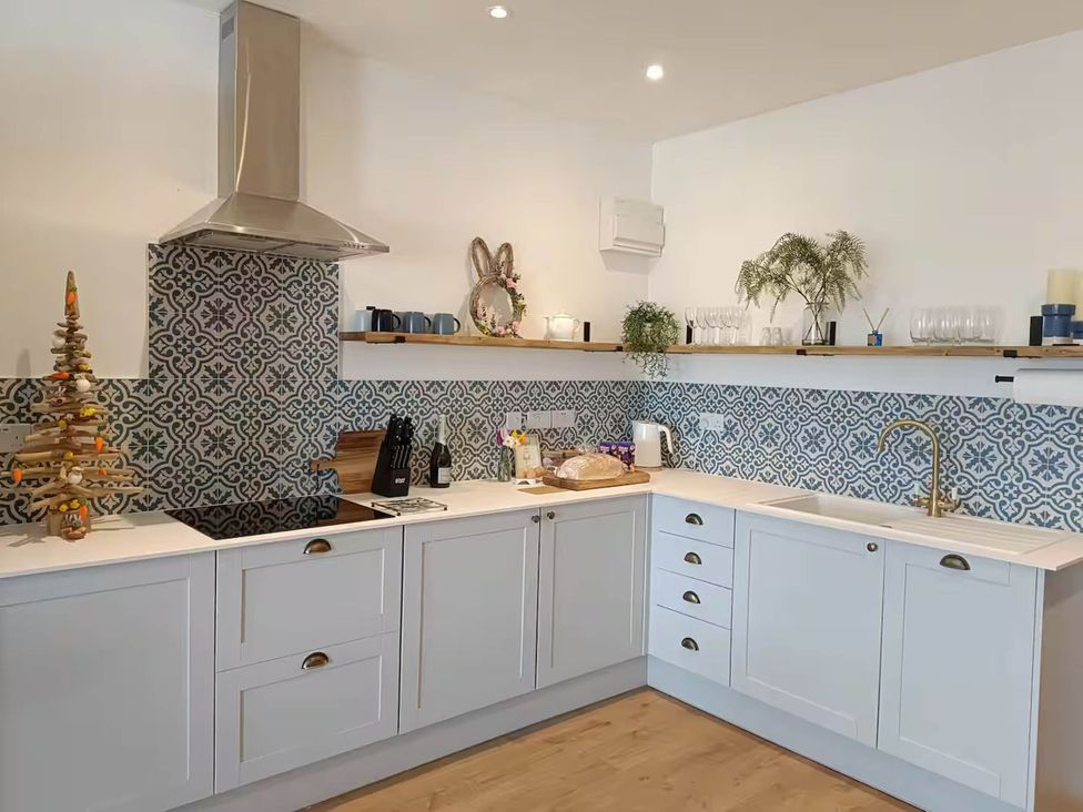 A kitchen with countertop, cabinets, and stove at Aberporth 2 Bed Cottage Sleeps 4 Pet Friendly Parcllyn near Aberporth